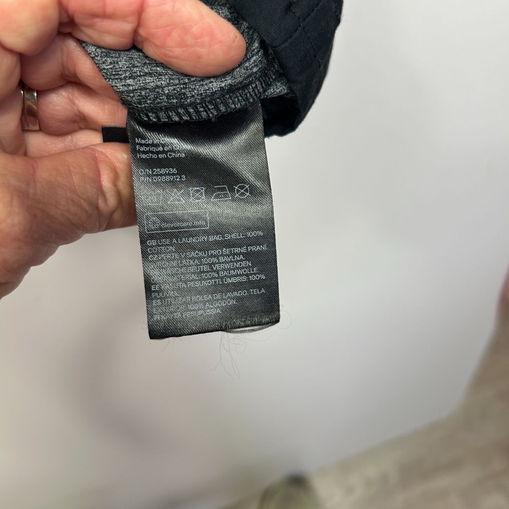Black beanie care label detail view