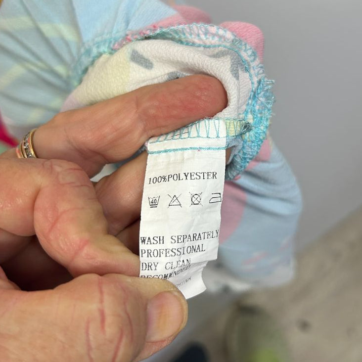 Clothing label detail view showing care instructions