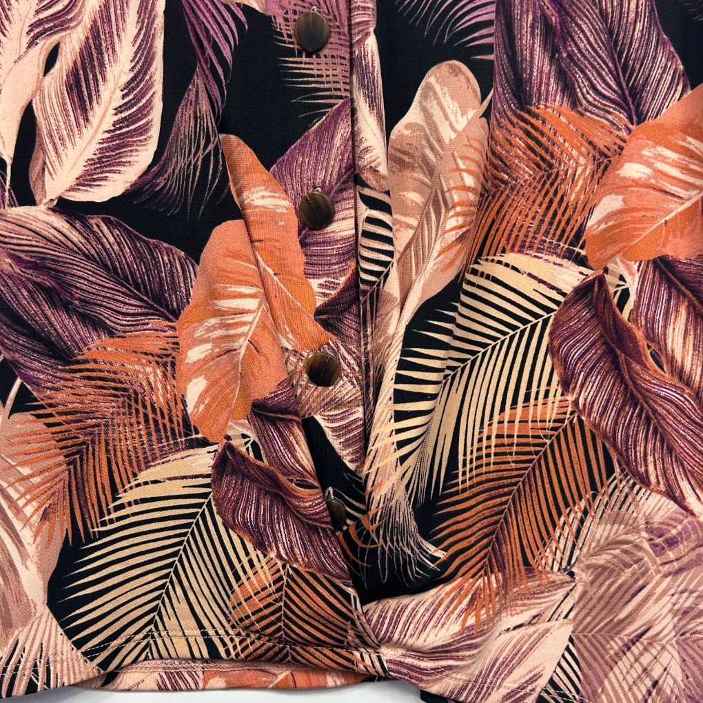 Purple and orange leaf print shirt detail view