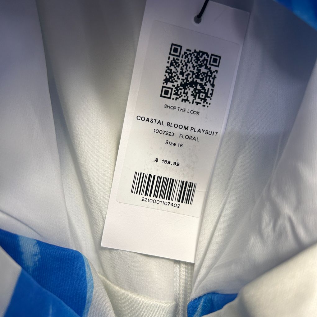 White floral dress label detail view