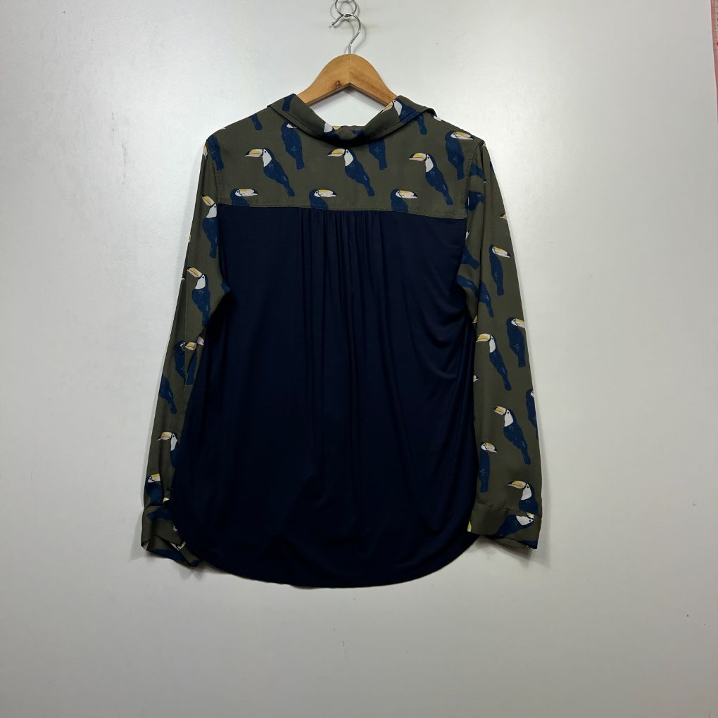 Navy blue blouse with gold leaf print sleeves front view