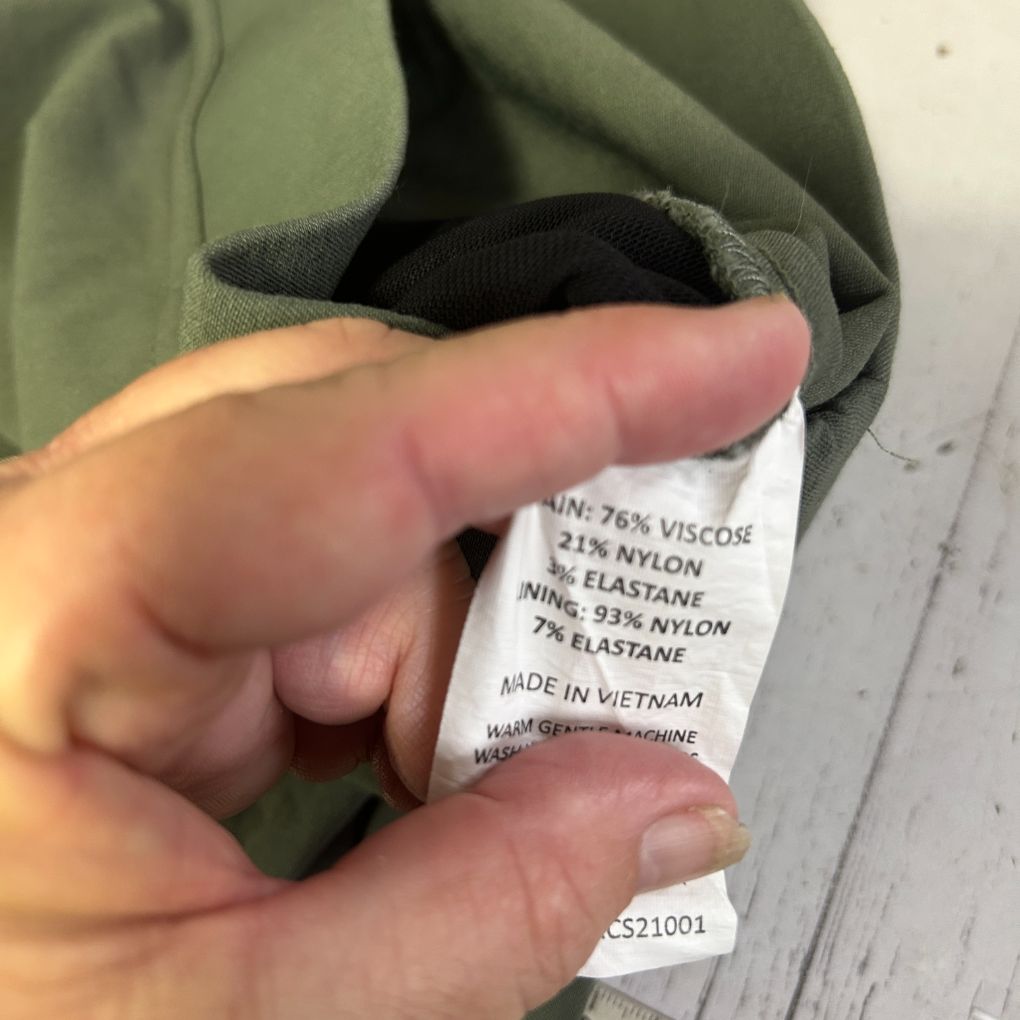 Olive green fabric label detail view