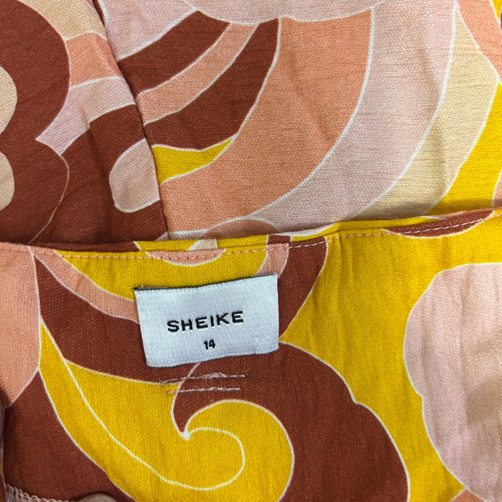 SHEIKE yellow brown and cream swirl pattern fabric detail view