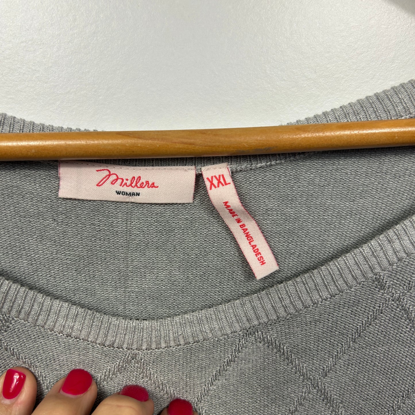 Grey sweatshirt label detail view