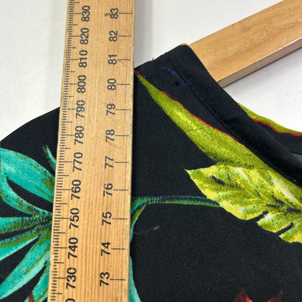 Black fabric with neon yellow and turquoise graphic detail view