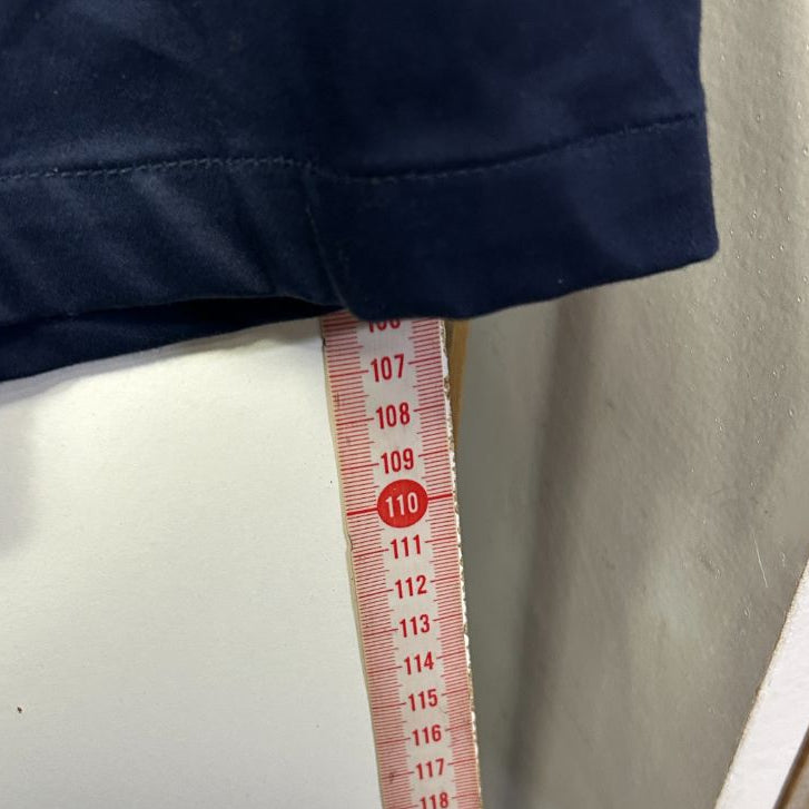 Navy shorts with measurement tape detail view