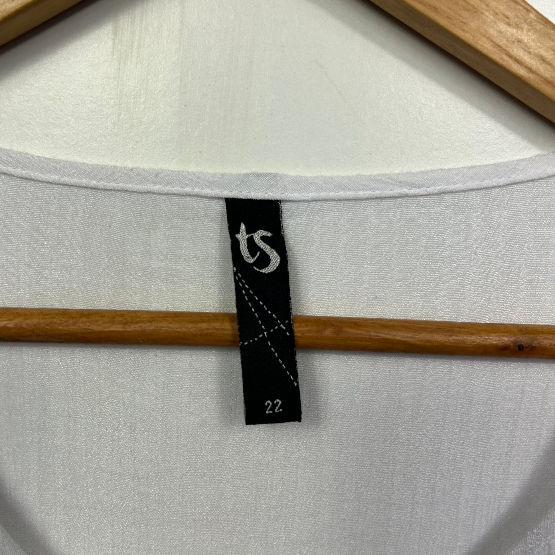 White long sleeve top label detail view