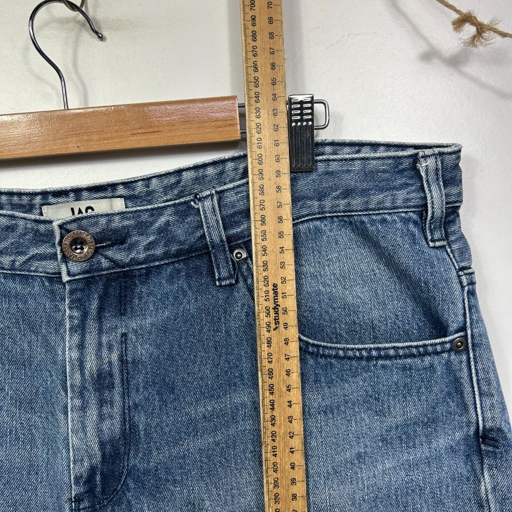 Blue denim jeans front view with measuring tape