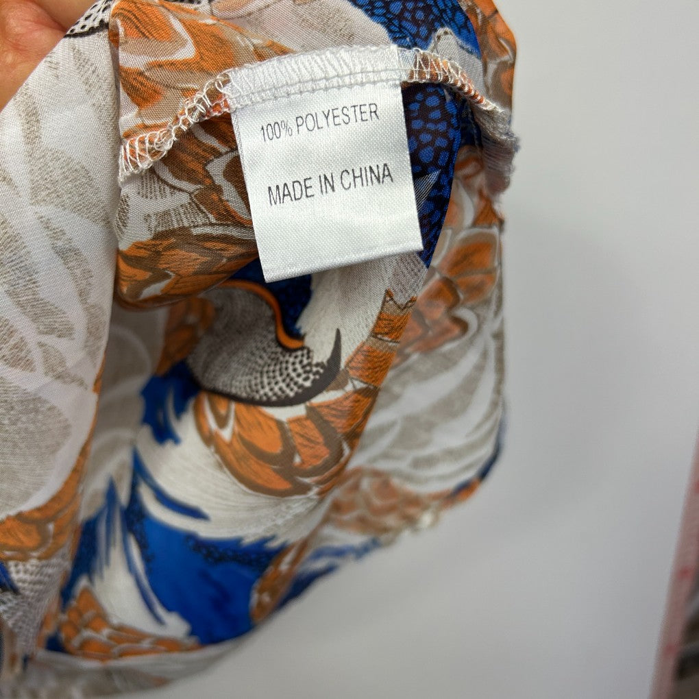 Multicoloured floral polyester fabric detail view with care label