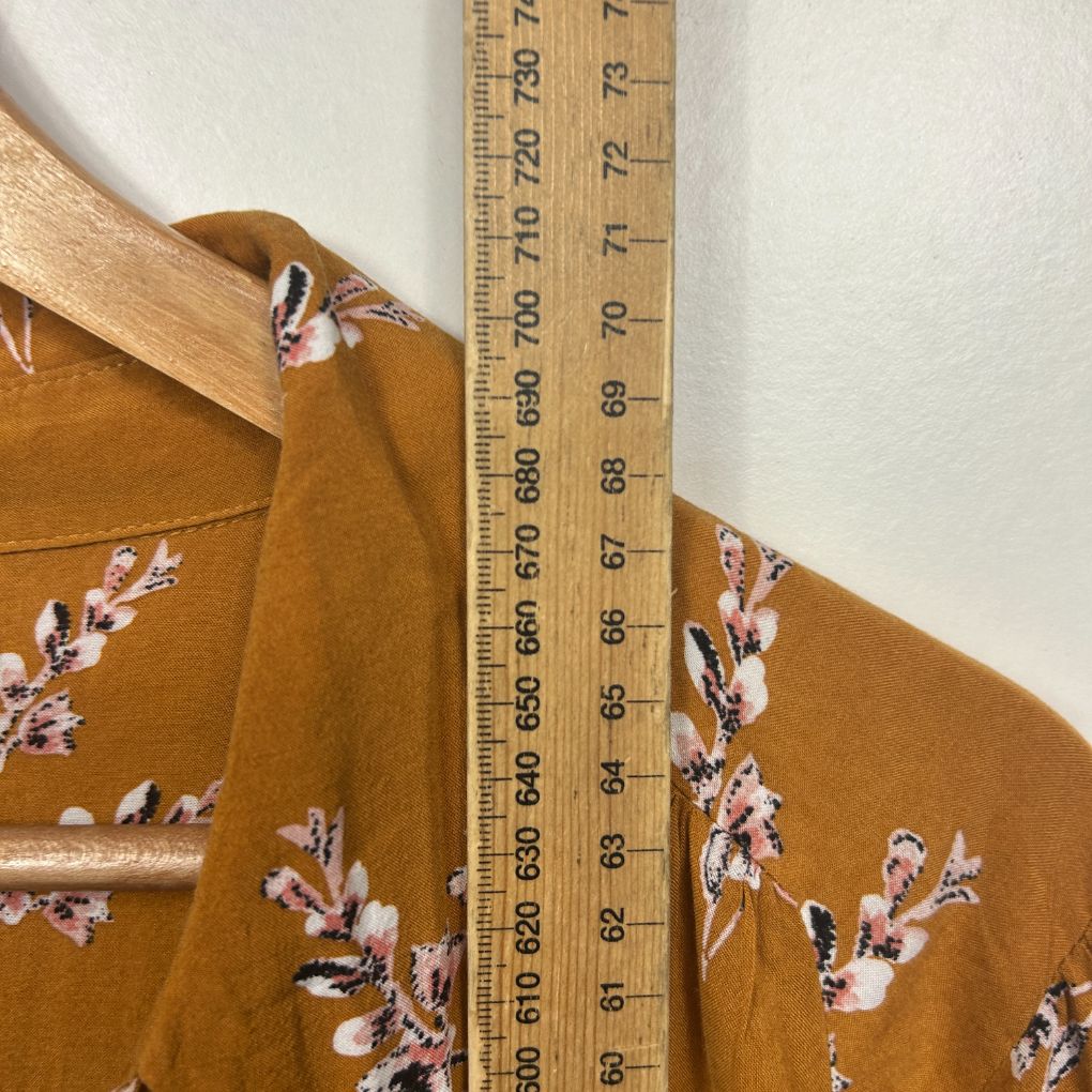Mustard brown shirt with floral embroidery detail view
