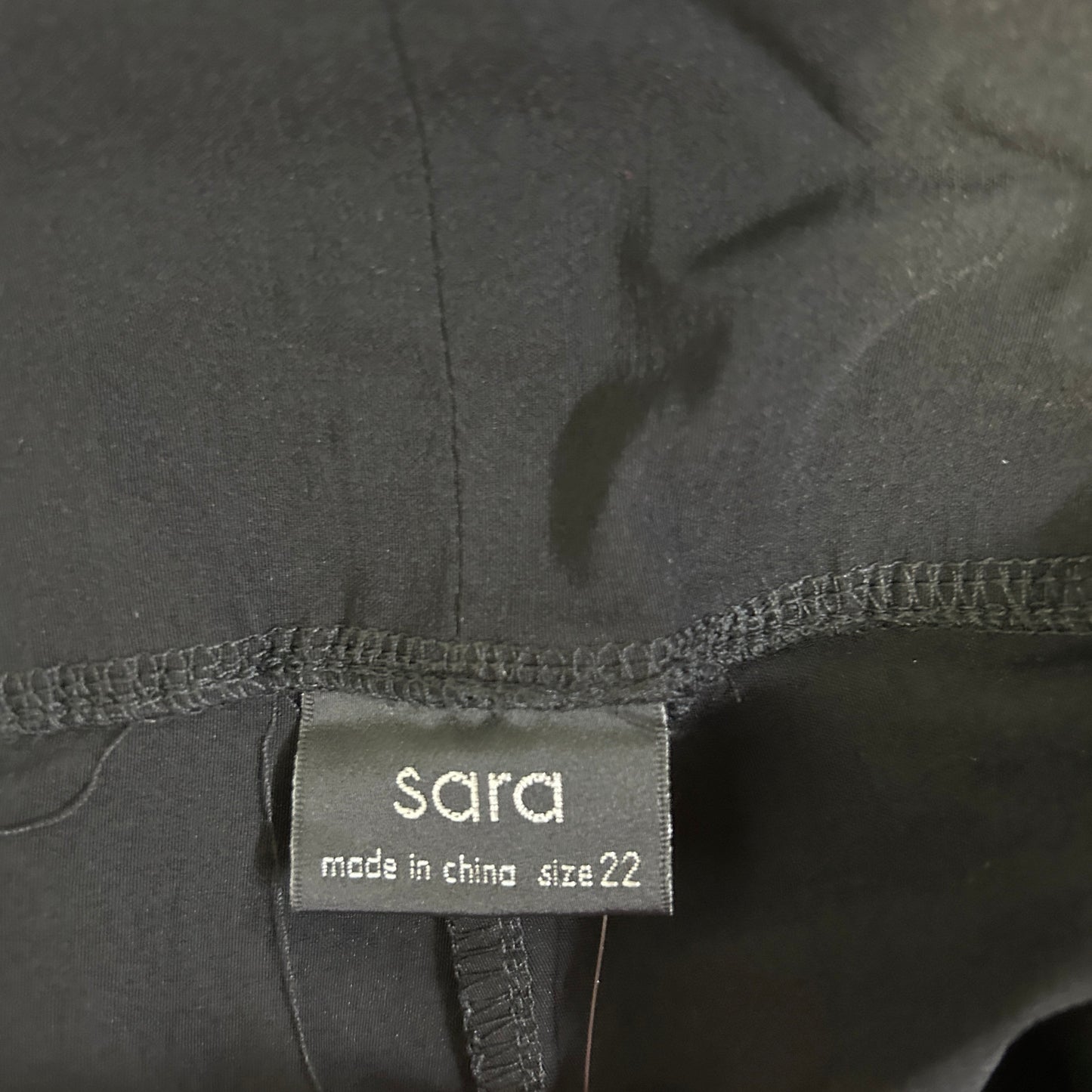 Grey garment label detail view
