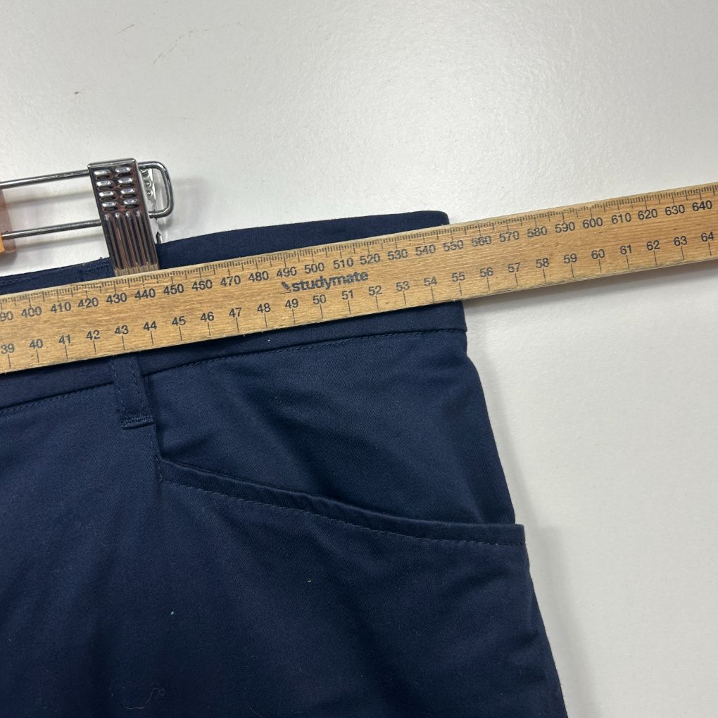 Navy pants waistband detail with measuring tape