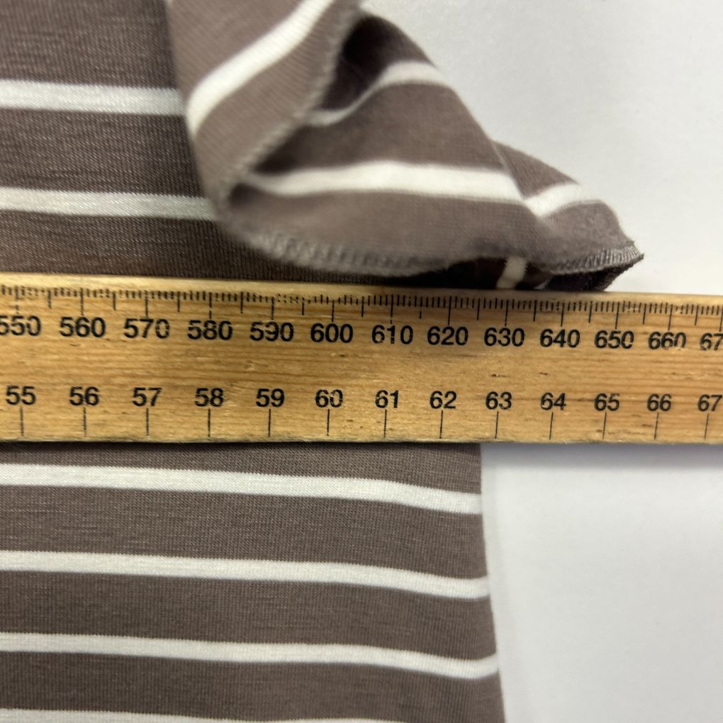 Grey and white striped top detail view with measuring tape