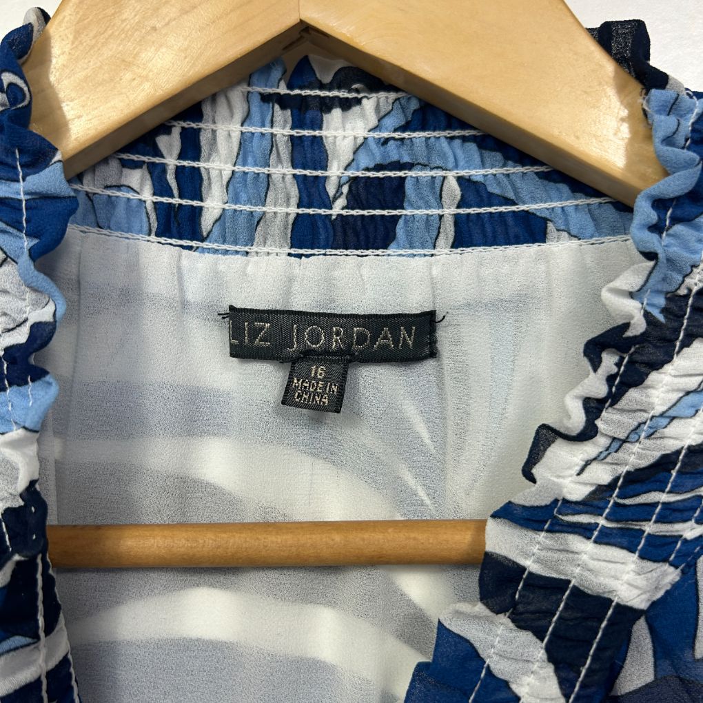 Blue and white striped shirt label and hanger detail view