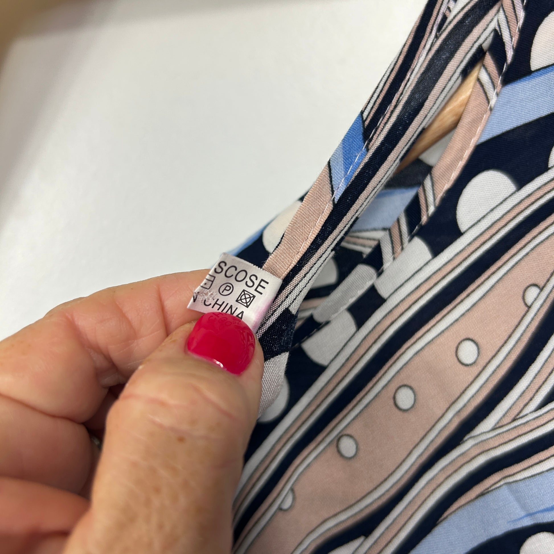 Clothing label detail view showing size and care instructions