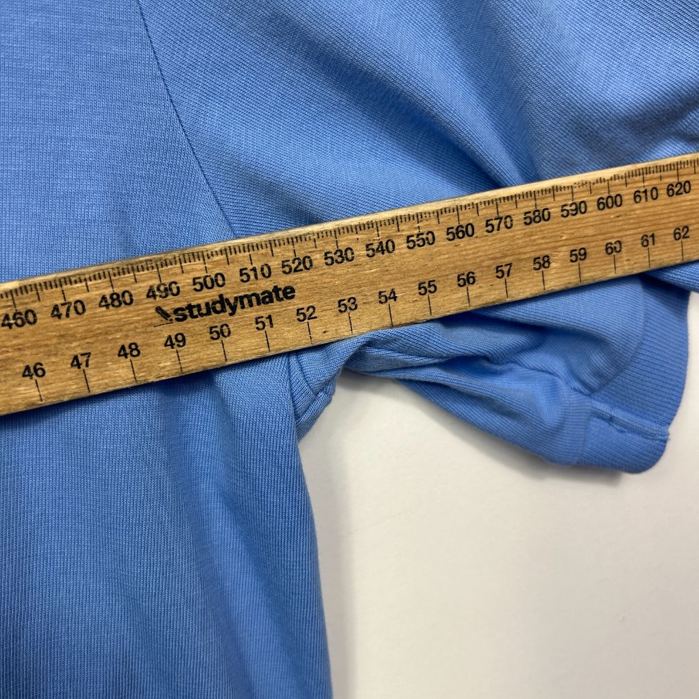 Blue fabric with measuring tape detail view