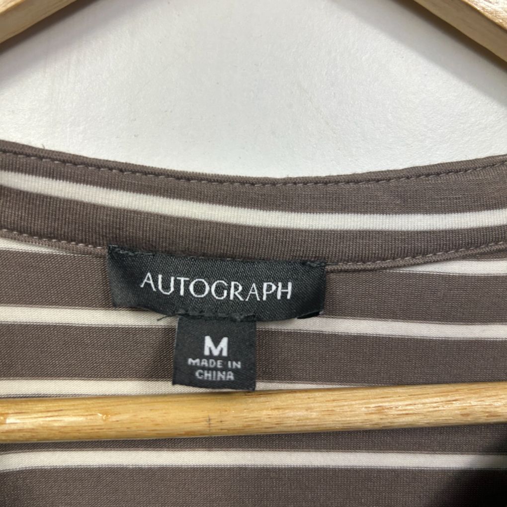 Brown and white striped top label detail view