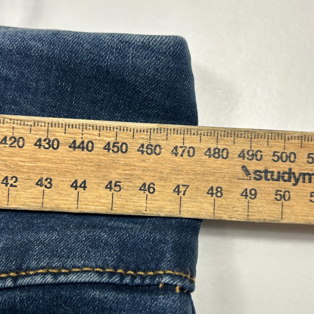 Dark blue denim with measuring tape detail view