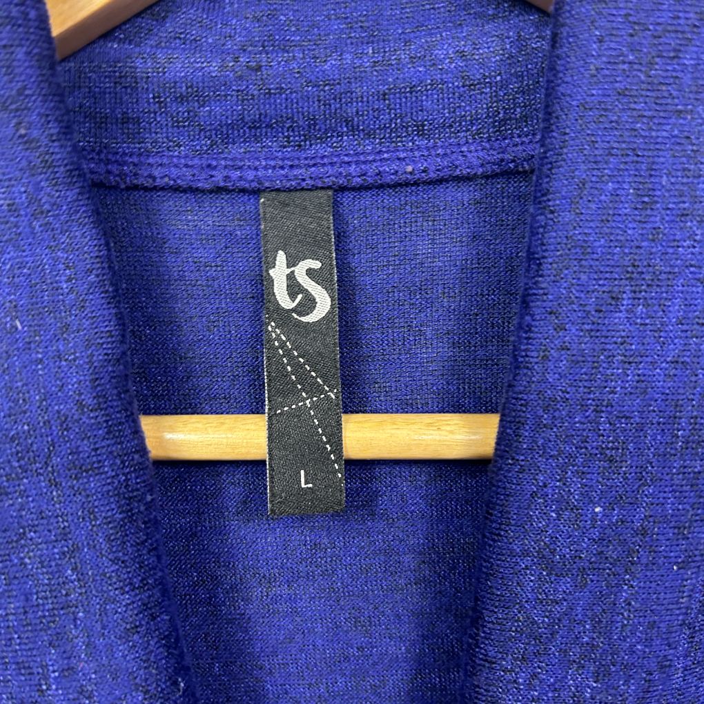 Blue knit sweater label detail view