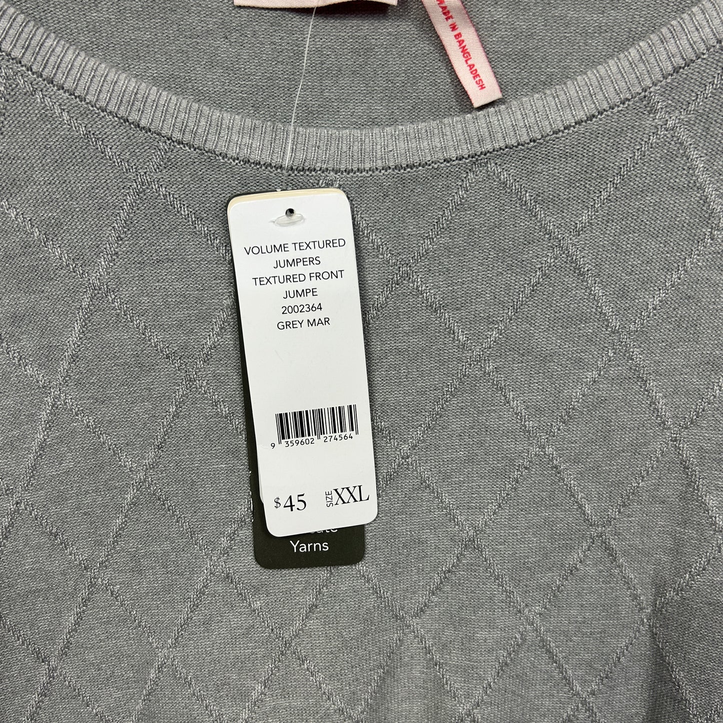 Grey jumper front view with textured quilted pattern