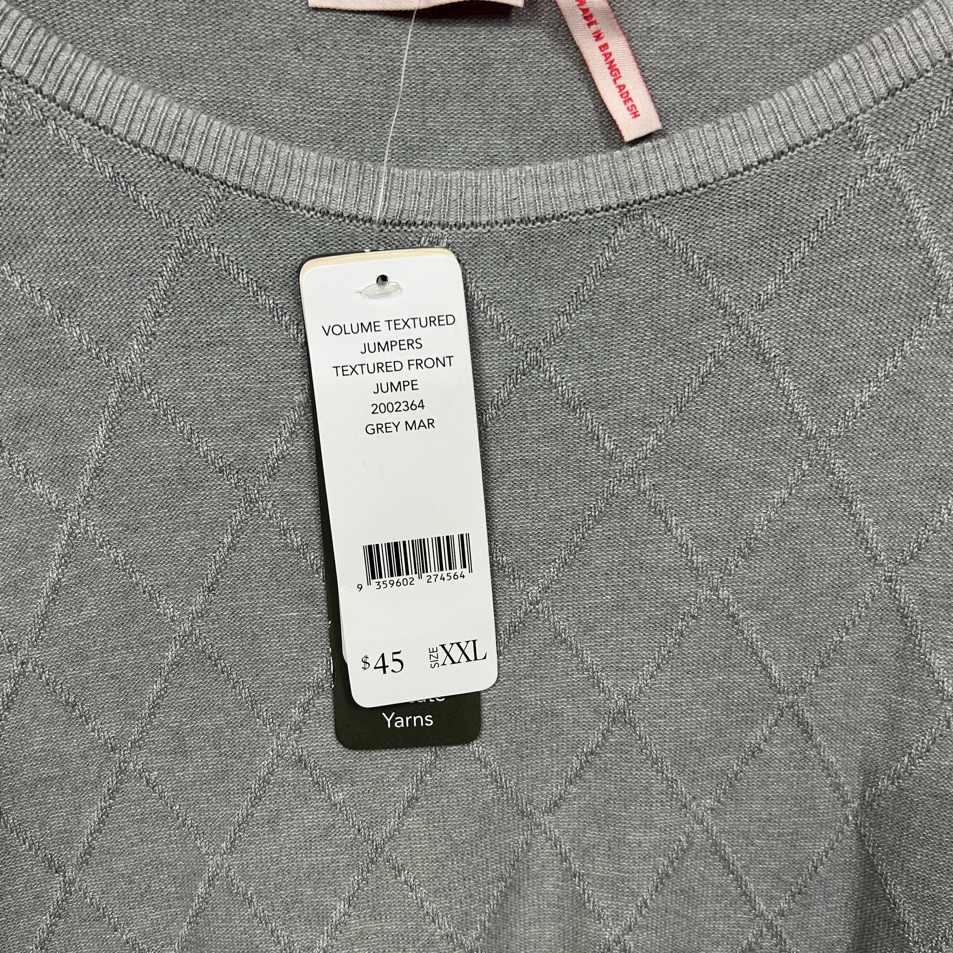 Grey jumper front view with textured quilted pattern