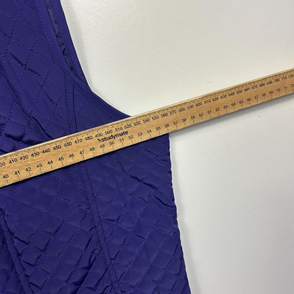 Blue fabric with measuring tape detail view