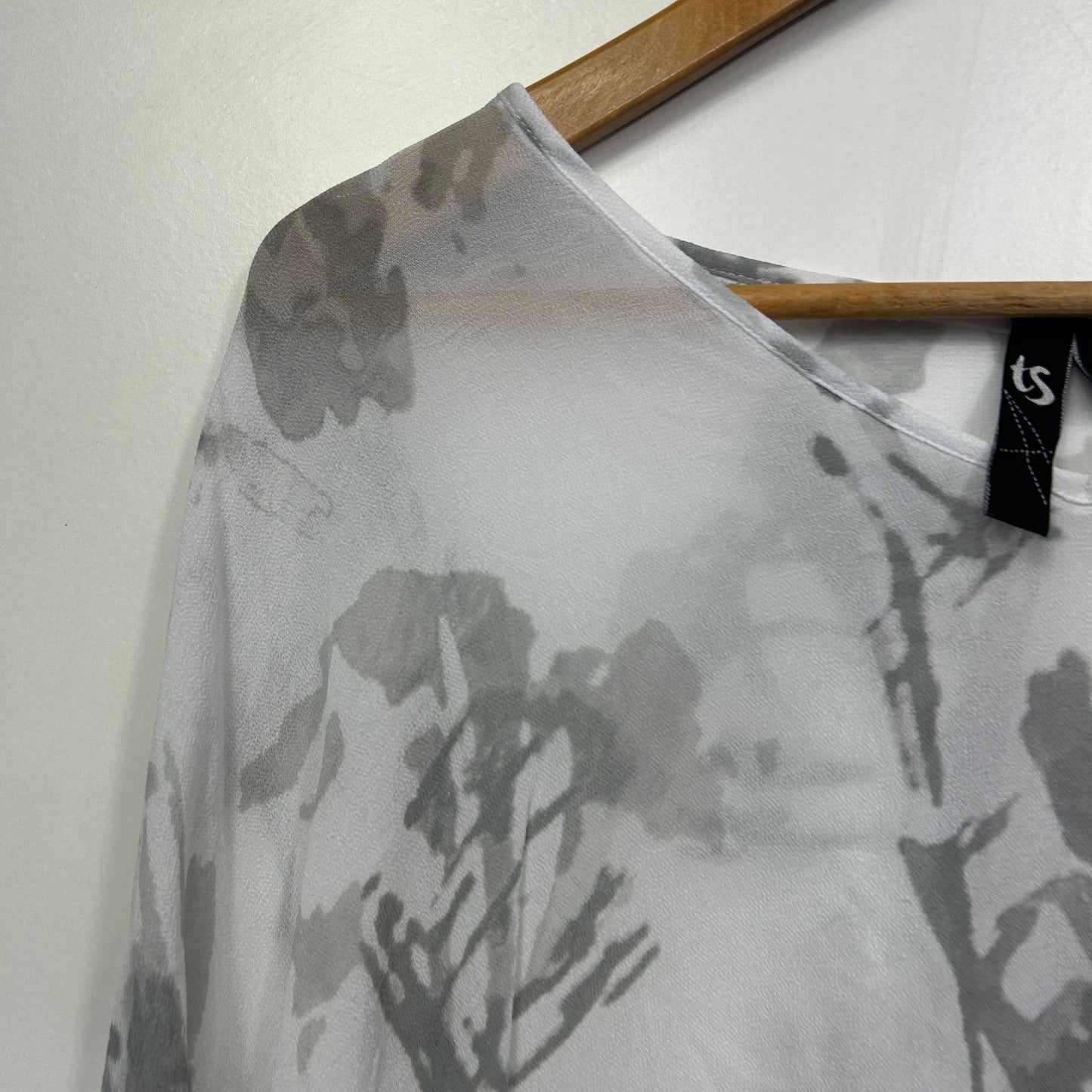 White t-shirt with grey floral graphic front view