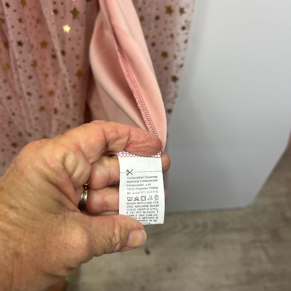 Pink garment care label detail view