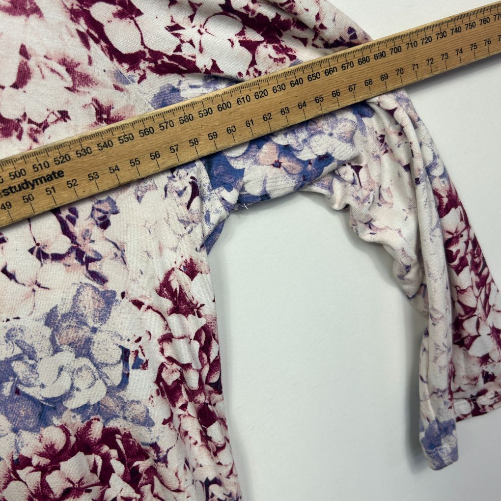 Burgundy and blue floral fabric detail view with measuring ruler