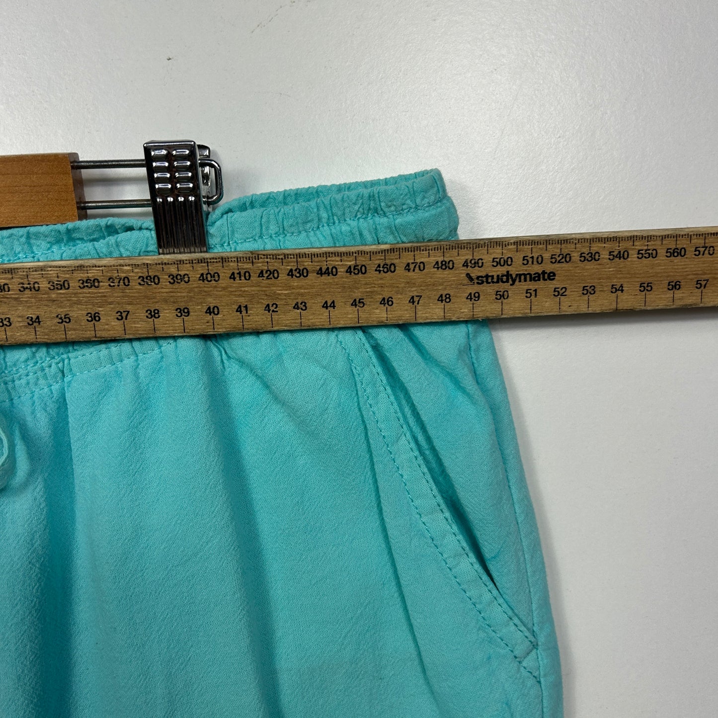 Turquoise shorts waistband detail view