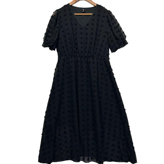 Black midi dress front view with textured dot pattern