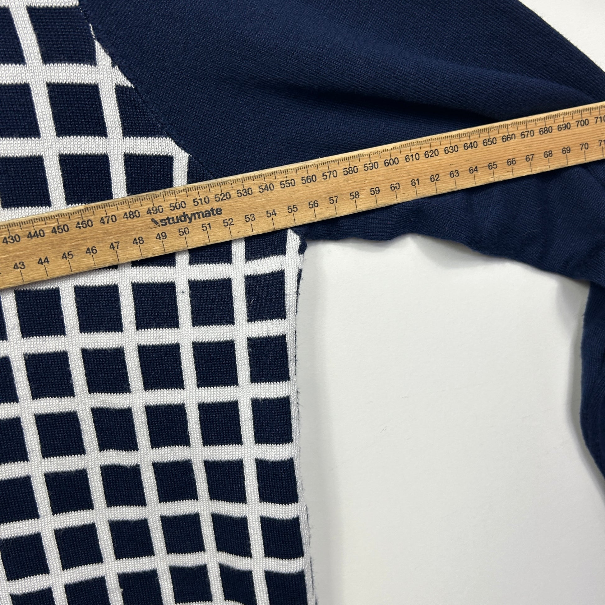 Navy and white grid pattern top detail view with measuring tape