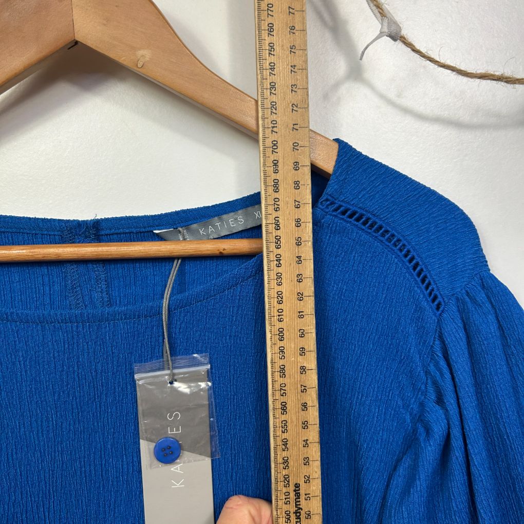 Blue top front view with measuring tape