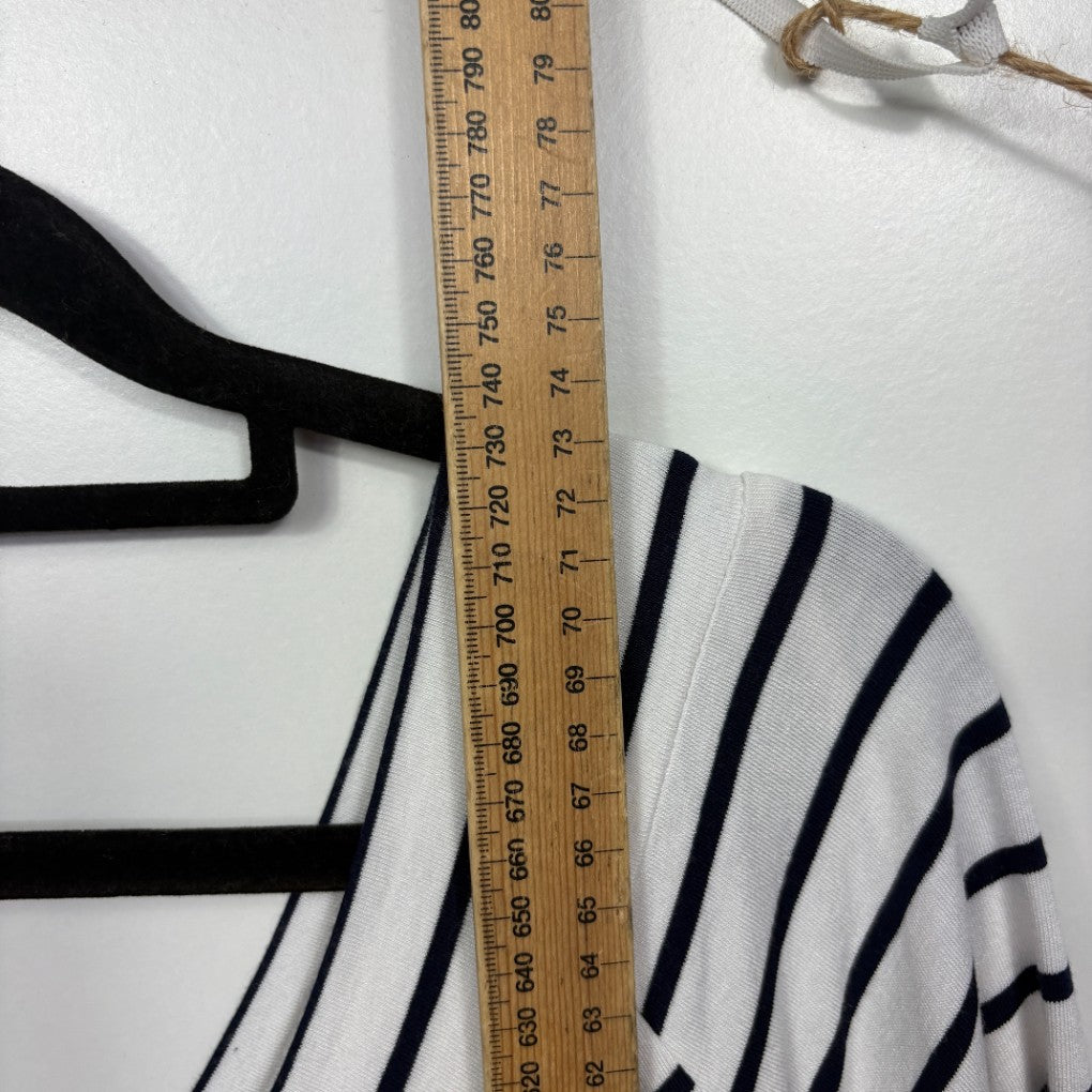 White and navy striped top front view with black straps