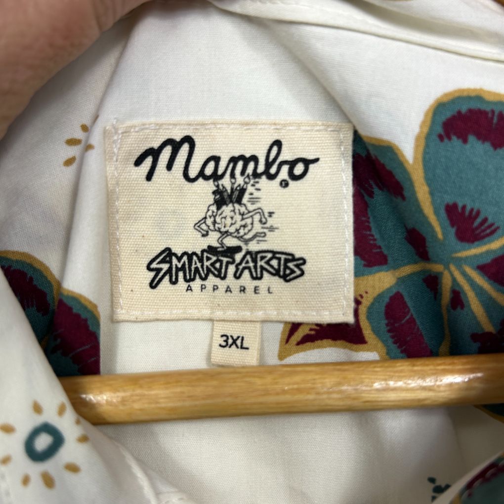 White jacket detail view showing Mambo Smartarts Apparel label