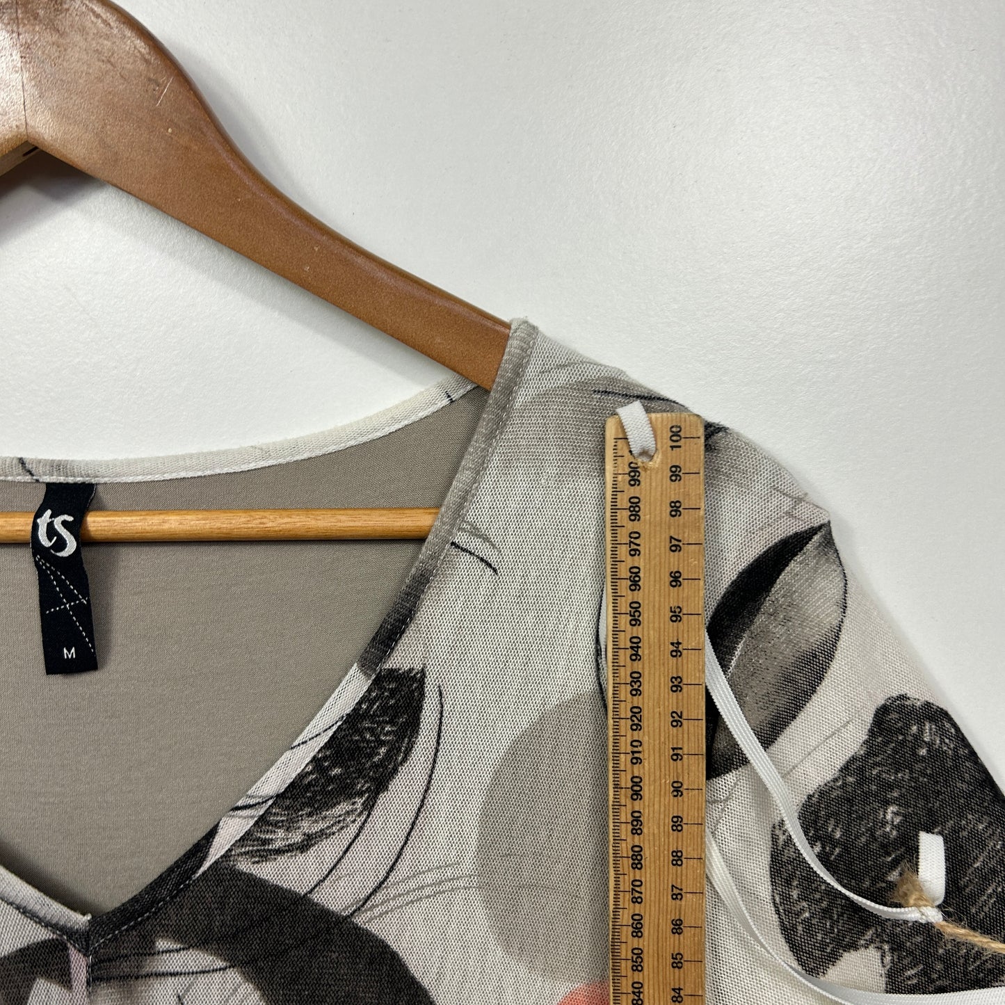 Grey graphic t-shirt detail view with ruler measurement