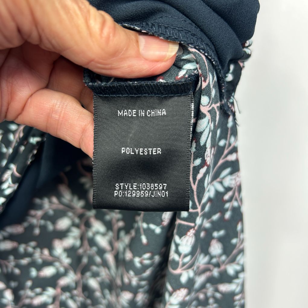 Black and white patterned garment label detail view