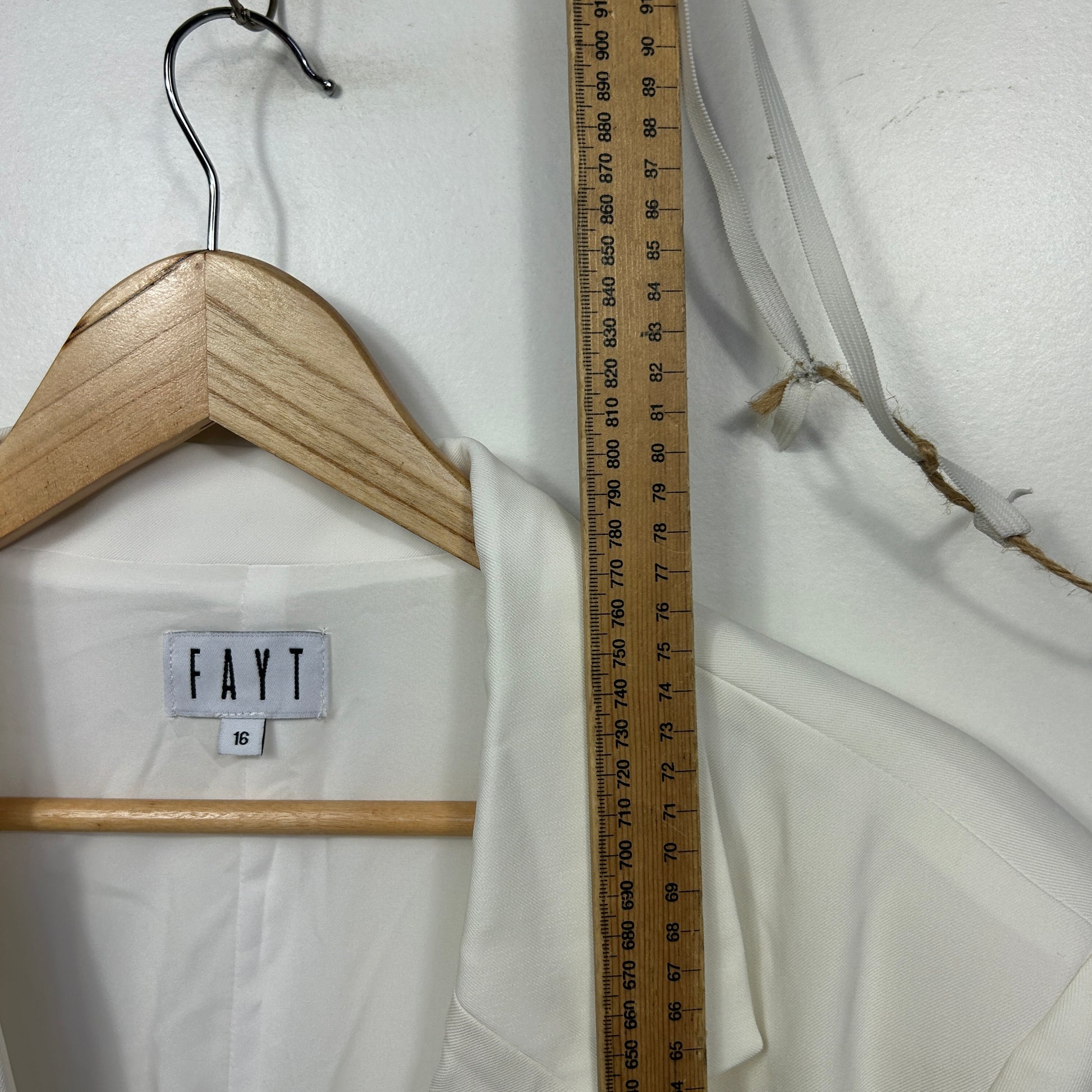 White slip dress front view with wooden hanger