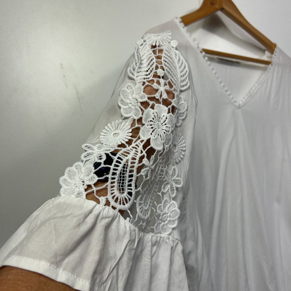 White lace dress detail view