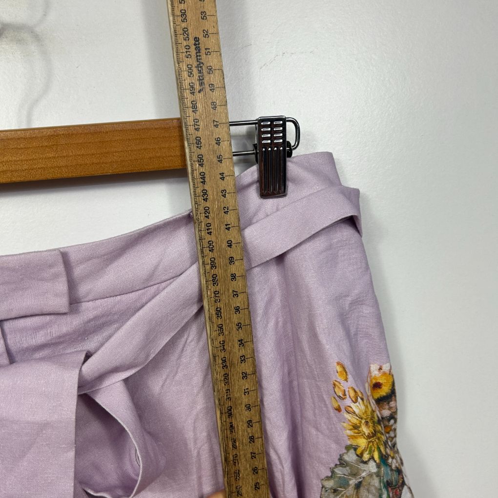 Lavender linen pants front view with floral embroidery detail