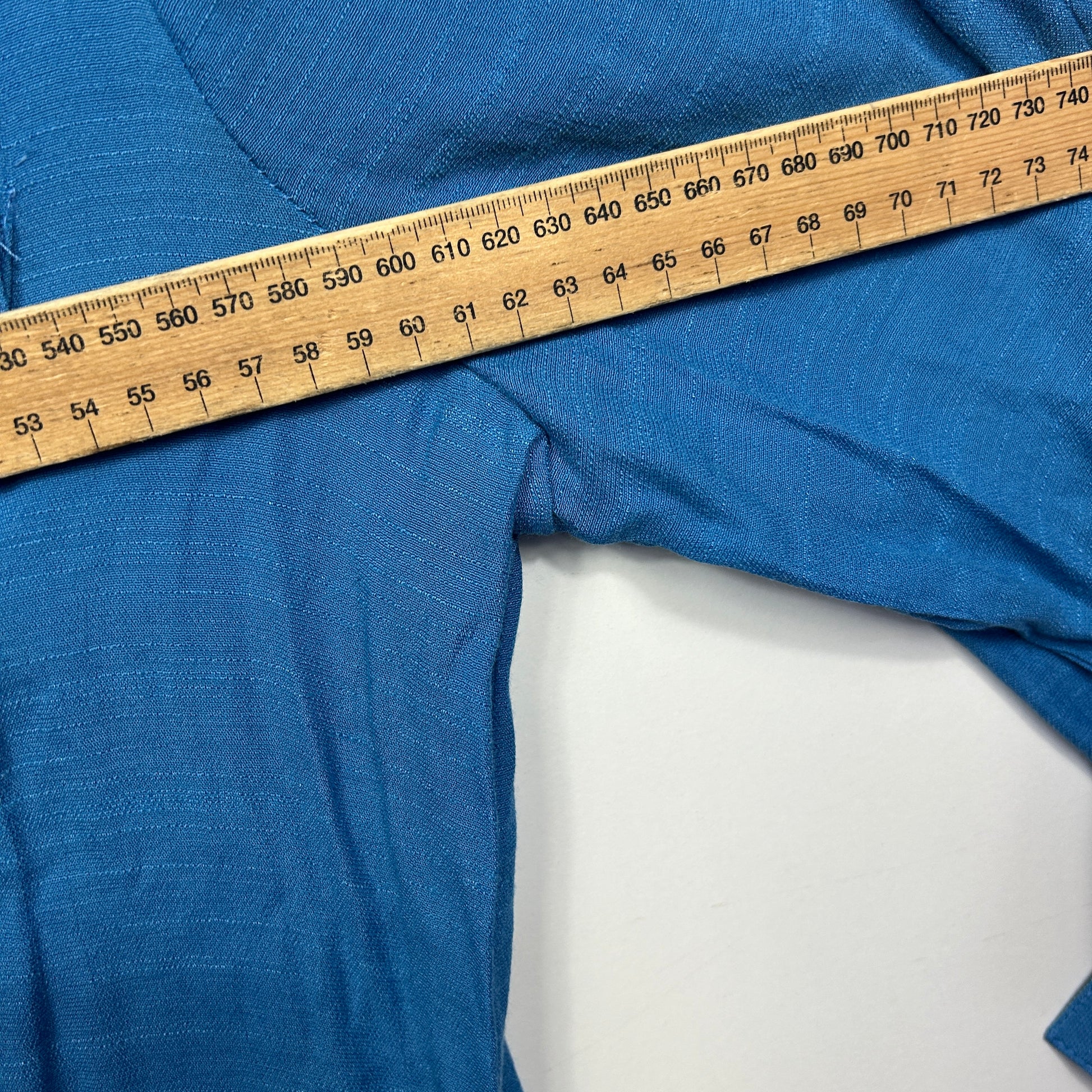 Blue fabric with measuring tape detail view