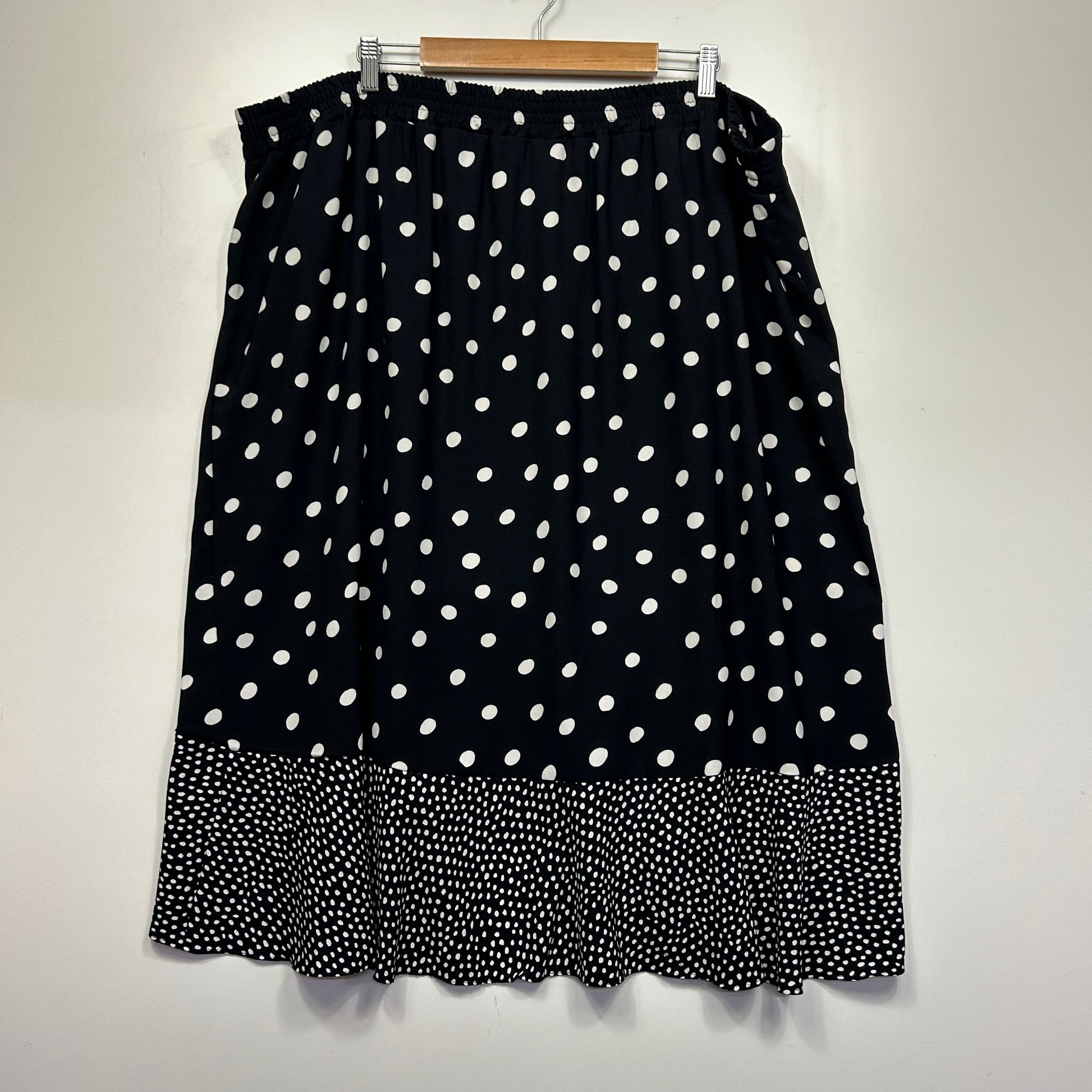 Black skirt with white polka dot pattern front view