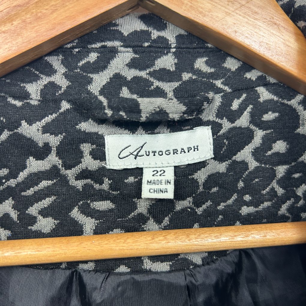 Black and cream leopard print jacket label detail view