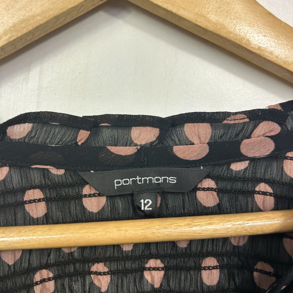 Black and nude graphic print top label detail view