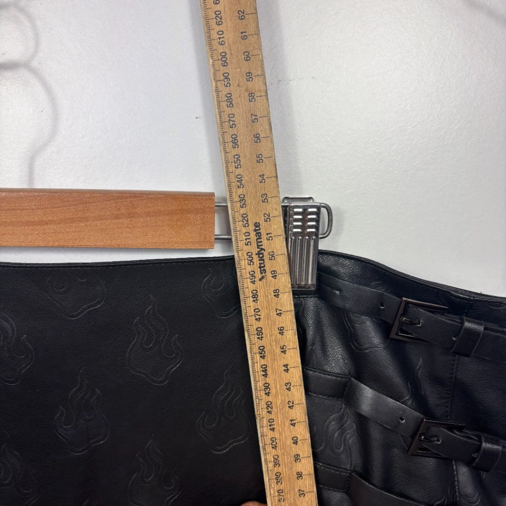 Black shorts detail view with ruler measurement