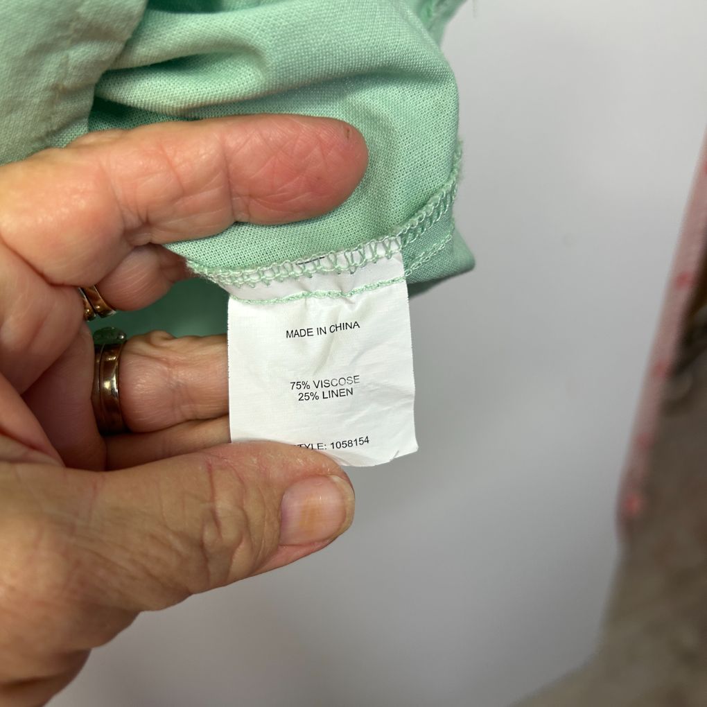 Green garment label detail view