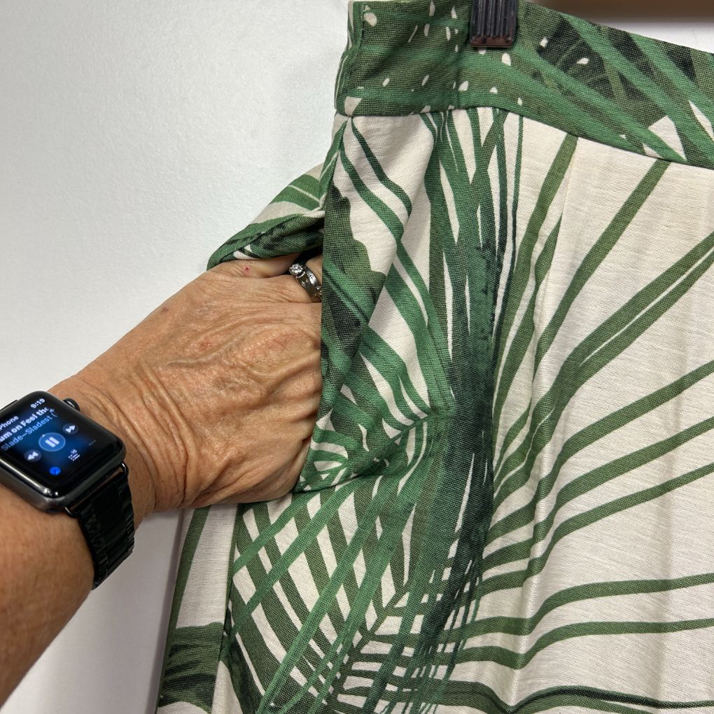 Green and white striped shirt detail view