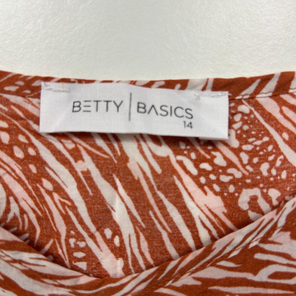 Betty Basics rust and white patterned top label detail view