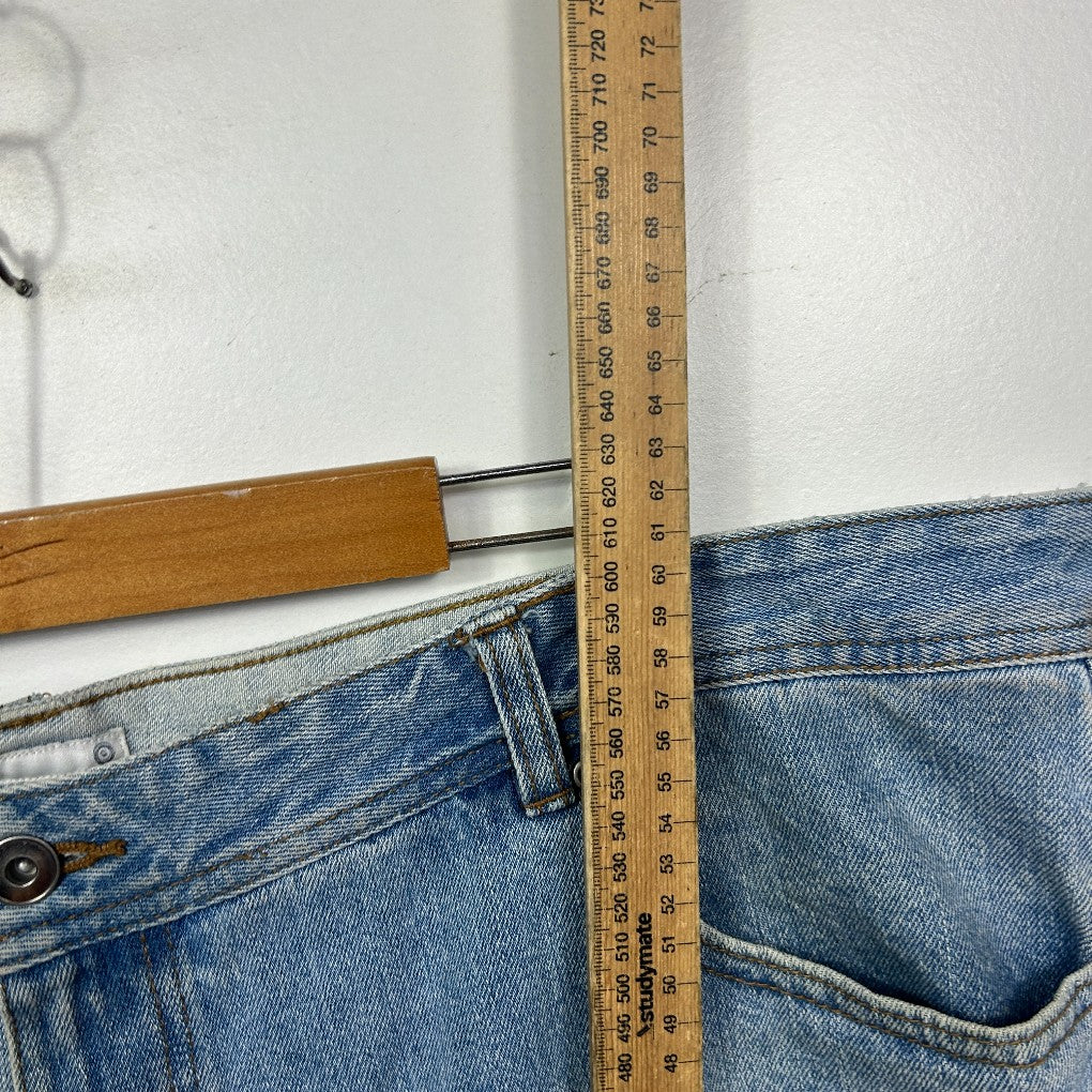 Blue denim jeans front view with measuring tape detail