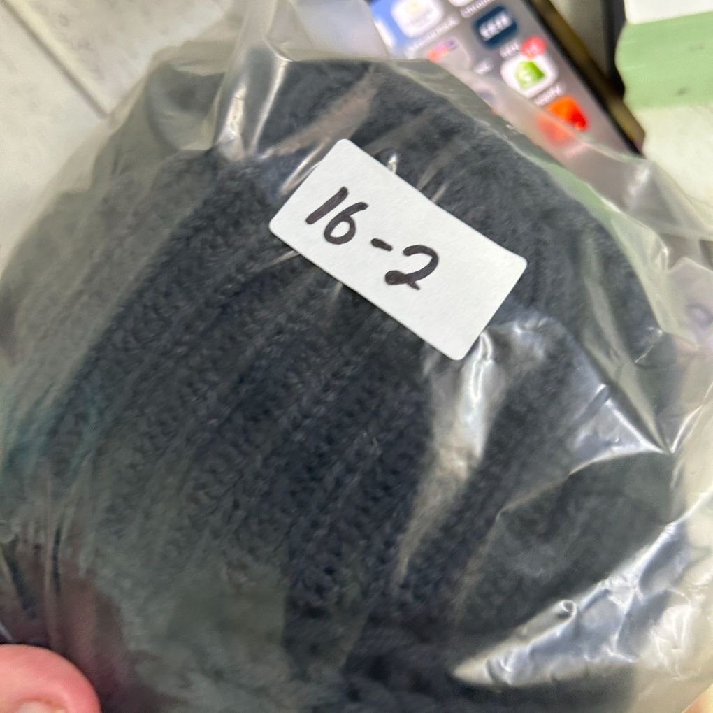 Dark grey ribbed knit beanie detail view